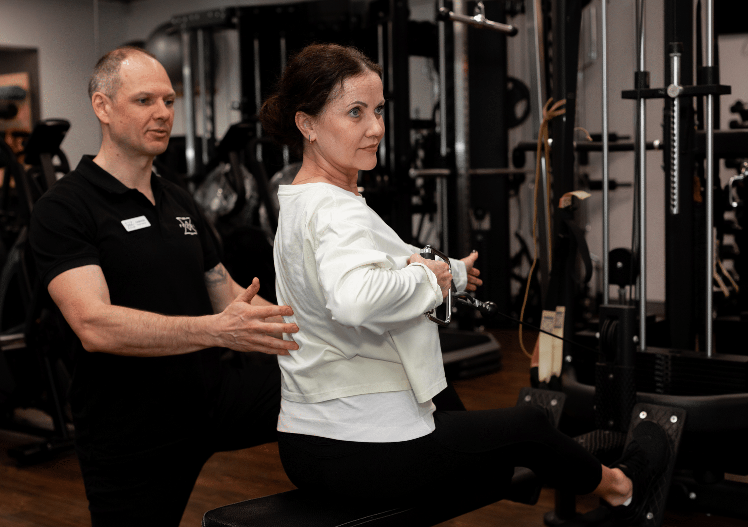 Clients of different ages training with a clinician in the rehabilitation gym at Forge West End